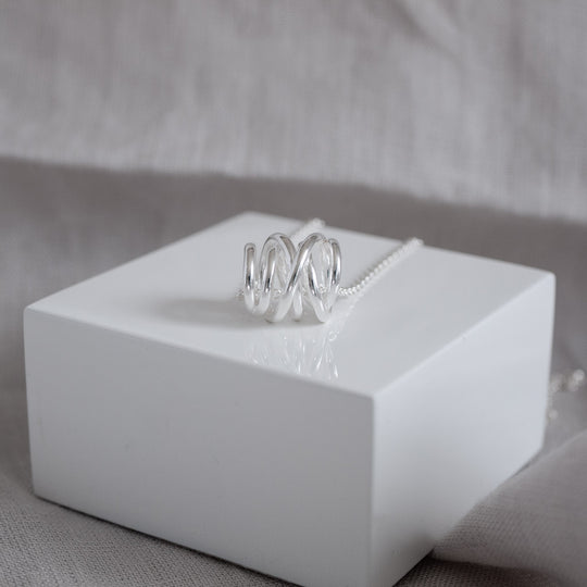 Carolyn Swirl Pendant Necklace